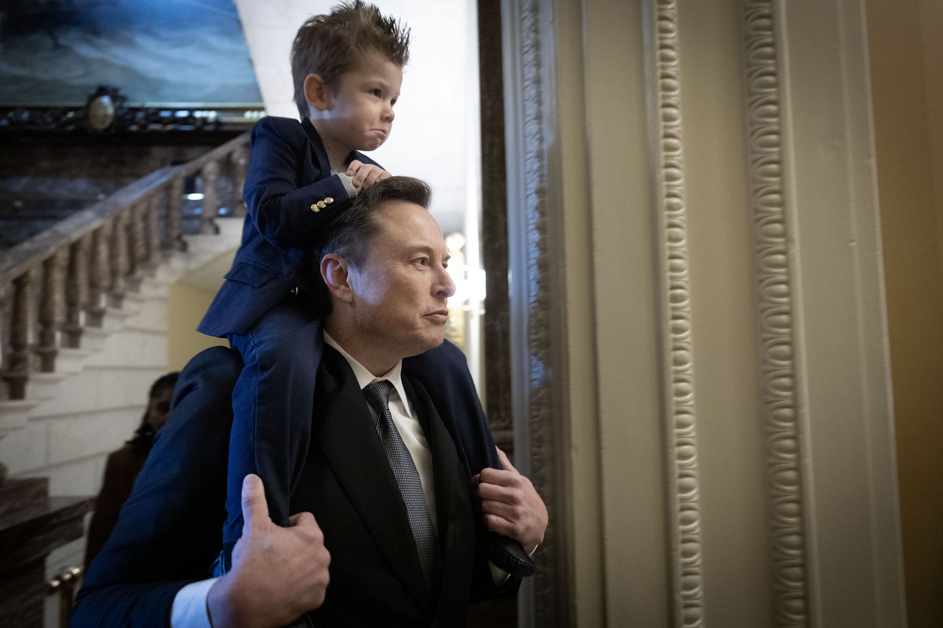 Elon Musk with his son X Æ A-Xii, whom he shares with Grimes, (Photo by Win McNamee/Getty Images)